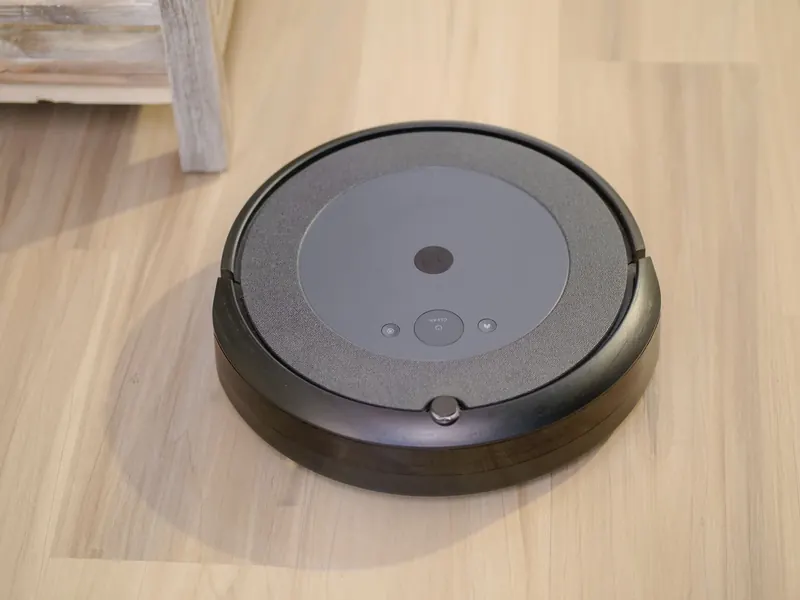 High-tech robotic vacuum cleaner efficiently cleaning modern floor indoors